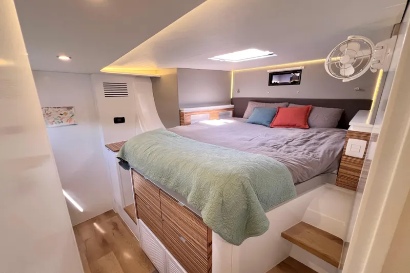 Ke'ala Yacht Photos Pics Luxurious bedroom interior in 2021 Balance 482 model, featuring modern design and cozy bedding.