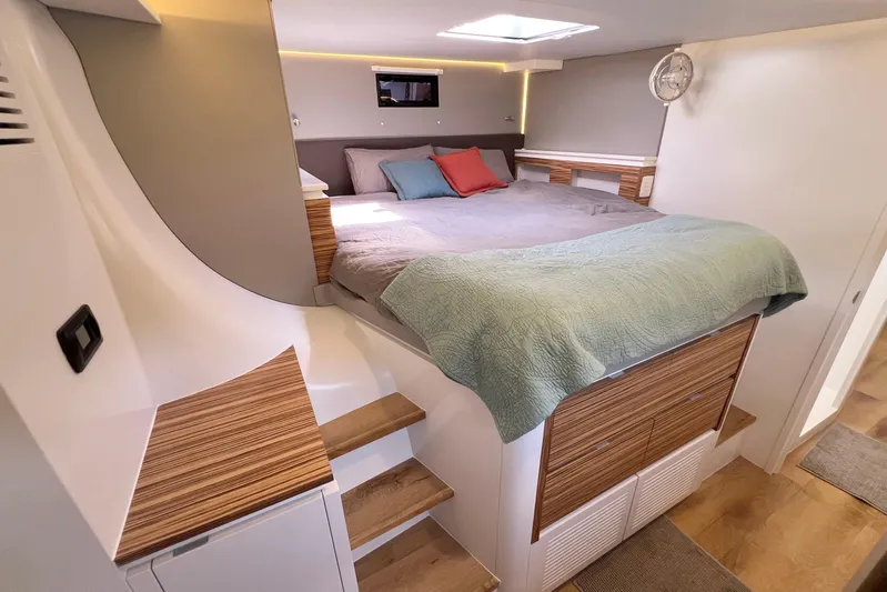Ke'ala Yacht Photos Pics Modern bedroom interior in 2021 Balance 482 yacht with cozy bed and wooden accents.