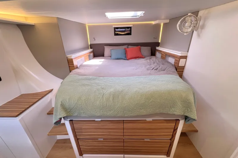 Ke'ala Yacht Photos Pics Modern bedroom interior in 2021 Balance 482 yacht with cozy bedding and wooden accents.