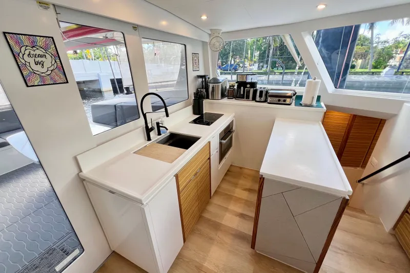Ke'ala Yacht Photos Pics Modern kitchen interior on a 2021 Balance 482 yacht, featuring sleek appliances and ample counter space.