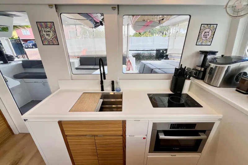 Ke'ala Yacht Photos Pics Modern kitchen interior on a 2021 Balance 482 yacht, featuring sleek appliances and stylish decor.