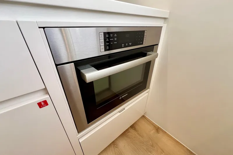 Ke'ala Yacht Photos Pics Modern built-in oven with digital controls, stainless steel finish, and sleek design.