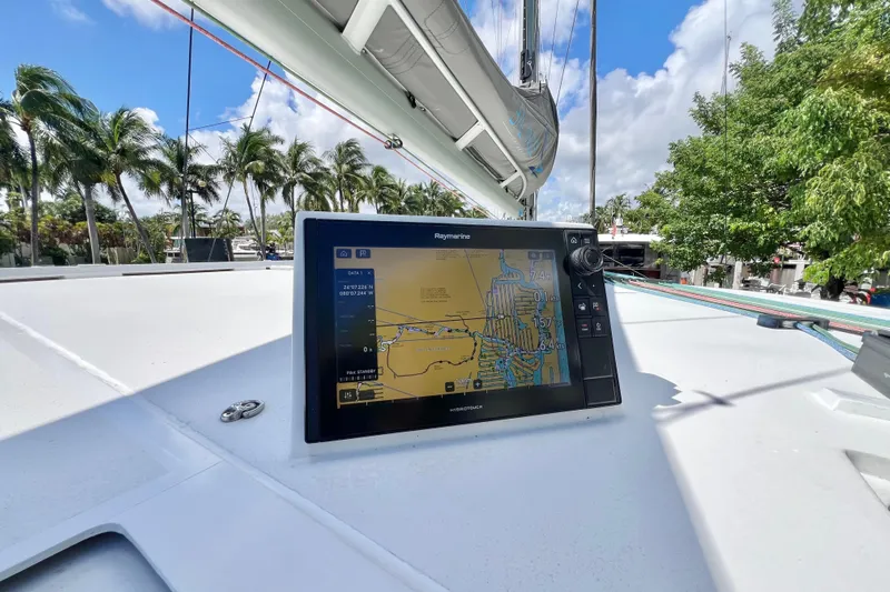 Ke'ala Yacht Photos Pics Sailboat navigation system on Balance 482, 2021 model, with tropical palm trees in the background.