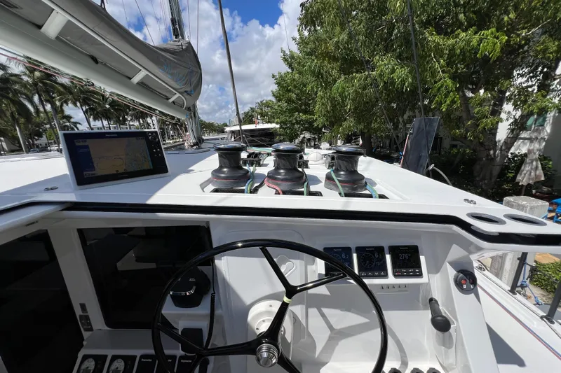 Ke'ala Yacht Photos Pics Sailboat cockpit with navigation equipment, Balance 482 model, 2021, under clear blue sky.