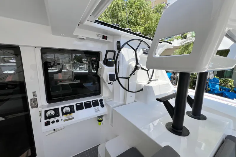 Ke'ala Yacht Photos Pics Interior of 2021 Balance 482 boat, featuring steering wheel and control panel.