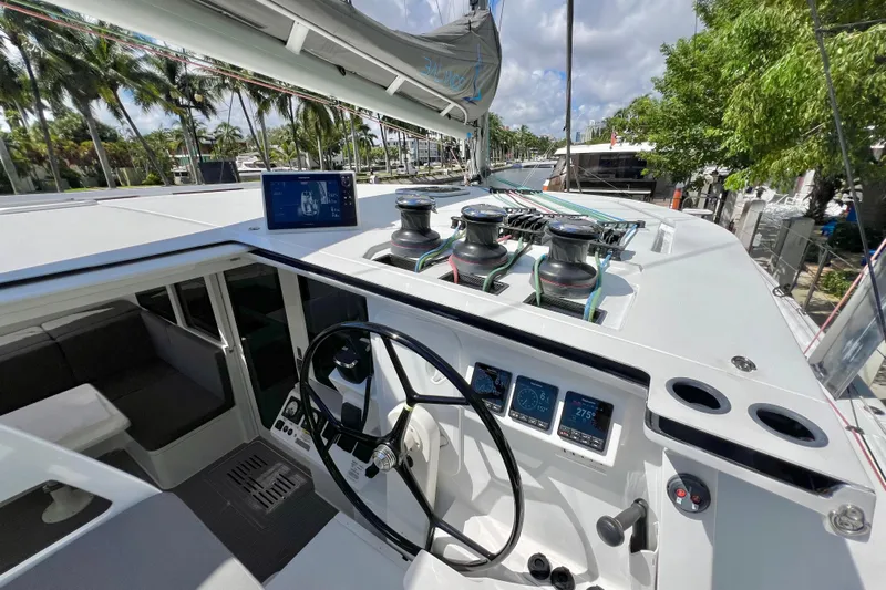 Ke'ala Yacht Photos Pics Modern Balance 482 yacht cockpit with steering wheel, navigation screens, and winches, 2021 model.