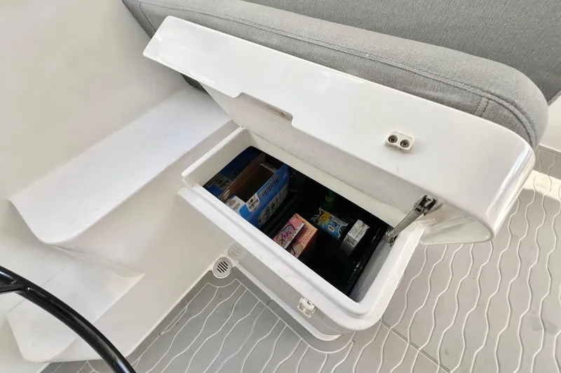 Ke'ala Yacht Photos Pics Open storage compartment in Balance 482 boat, revealing snacks and drinks inside.