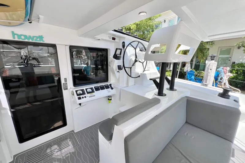 Ke'ala Yacht Photos Pics Interior of 2021 Balance 482 catamaran with steering wheel and seating area.