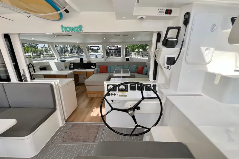 Ke'ala Yacht Photos Pics Interior of 2021 Balance 482 catamaran with modern seating and steering wheel.