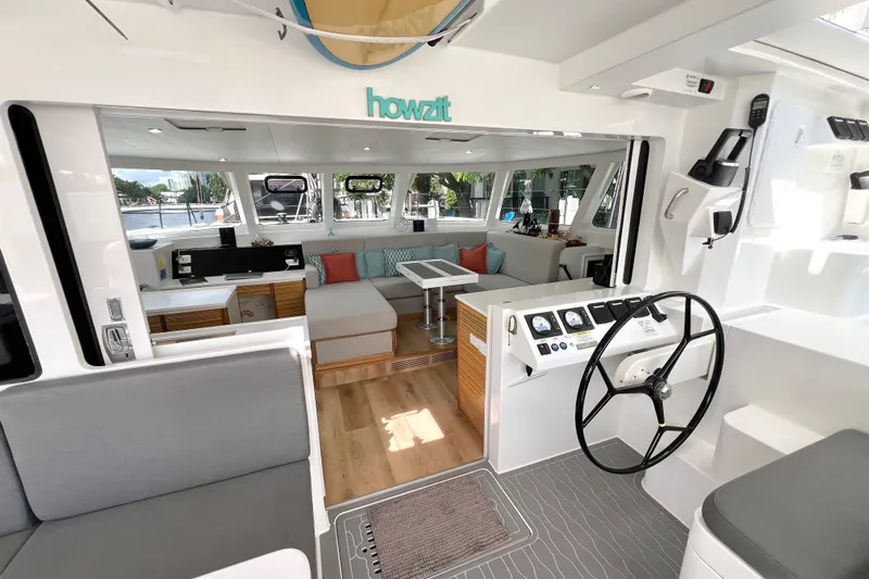 Ke'ala Yacht Photos Pics Luxurious interior of 2021 Balance 482 yacht with modern seating and navigation area.