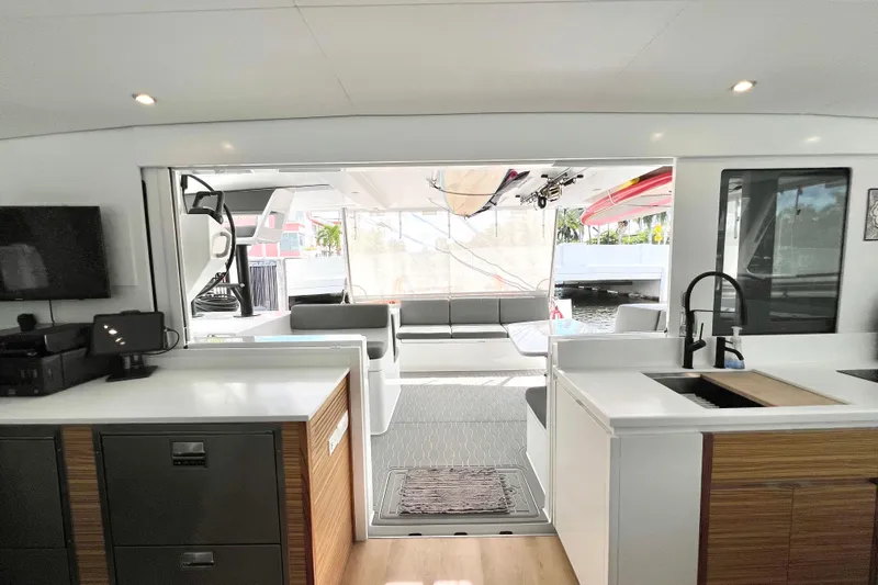 Ke'ala Yacht Photos Pics Modern interior of 2021 Balance 482 yacht with sleek kitchen and spacious seating area.