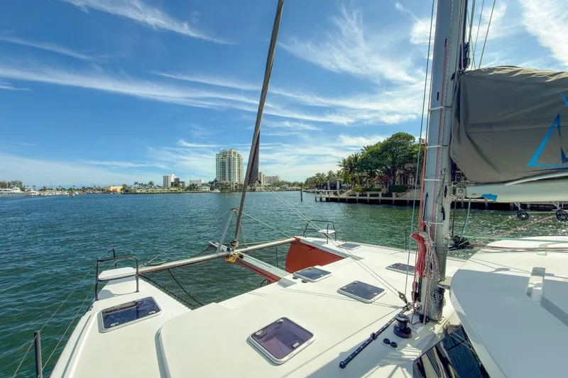 Ke'ala Yacht Photos Pics Sailing on a Balance 482 catamaran, 2021 model, with coastal cityscape view.