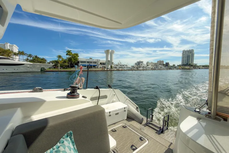 Ke'ala Yacht Photos Pics Catamaran Balance 482 cruising near marina, city skyline in background, sunny day, 2021 model.