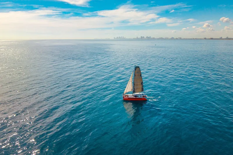 Ke'ala Yacht Photos Pics Sailboat Balance 482 on open sea with city skyline in background, 2021 model.