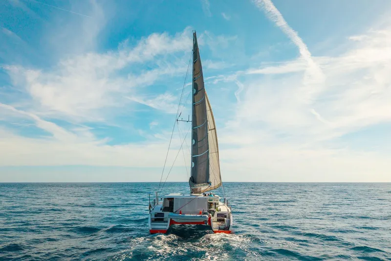 Ke'ala Yacht Photos Pics Sailing catamaran Balance 482, 2021 model, cruising on open sea under clear blue sky.