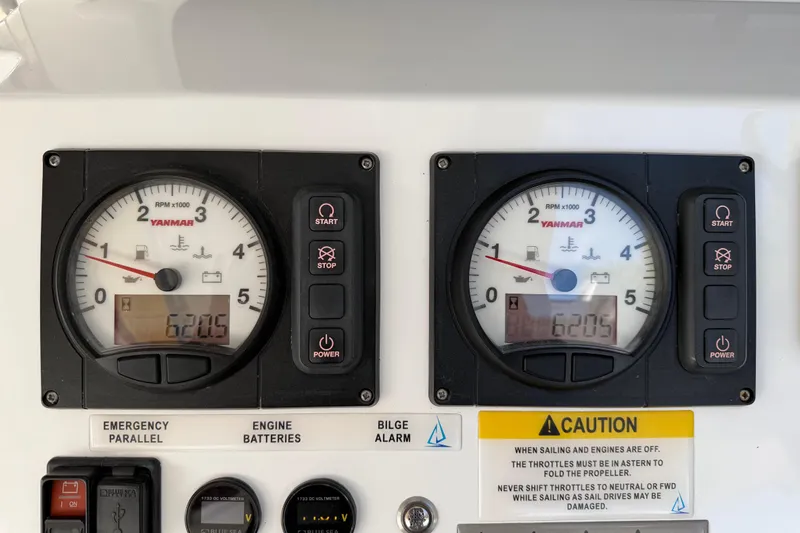 Ke'ala Yacht Photos Pics Control panel with dual Yanmar RPM gauges, caution labels, and engine controls on a Balance 482, 2021.