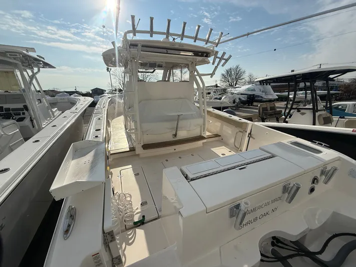 "ahhh Nice" Yacht Photos Pics 2018 Pursuit S 368 Sport boat docked under sunny skies.