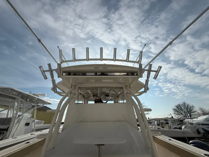 "ahhh Nice" Yacht Photos Pics 2018 Pursuit S 368 Sport boat under cloudy sky.