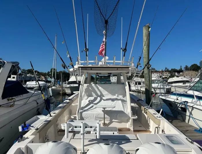 "ahhh Nice" Yacht Photos Pics 2018 Pursuit S 368 Sport boat docked with fishing rods.