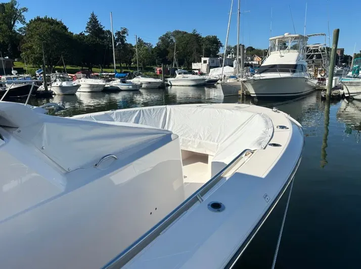"ahhh Nice" Yacht Photos Pics 2018 Pursuit S 368 Sport docked, surrounded by other boats.