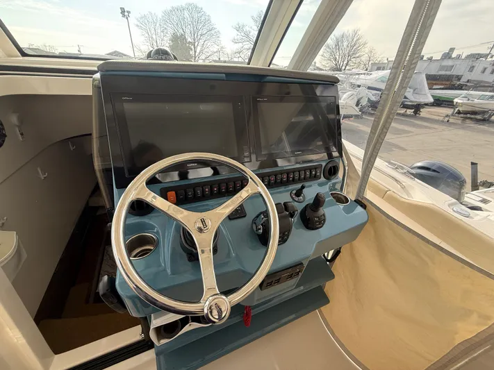 "ahhh Nice" Yacht Photos Pics Helm console of a 2018 Pursuit S 368 Sport boat.