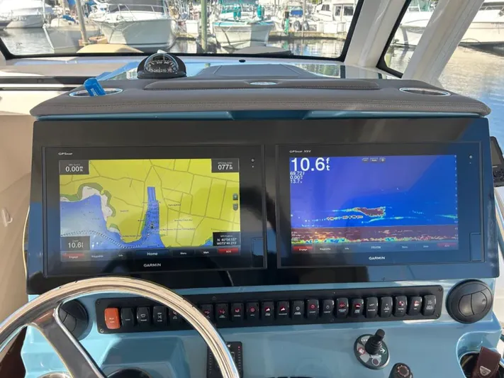 "ahhh Nice" Yacht Photos Pics Dashboard of a 2018 Pursuit S 368 Sport with Garmin displays.