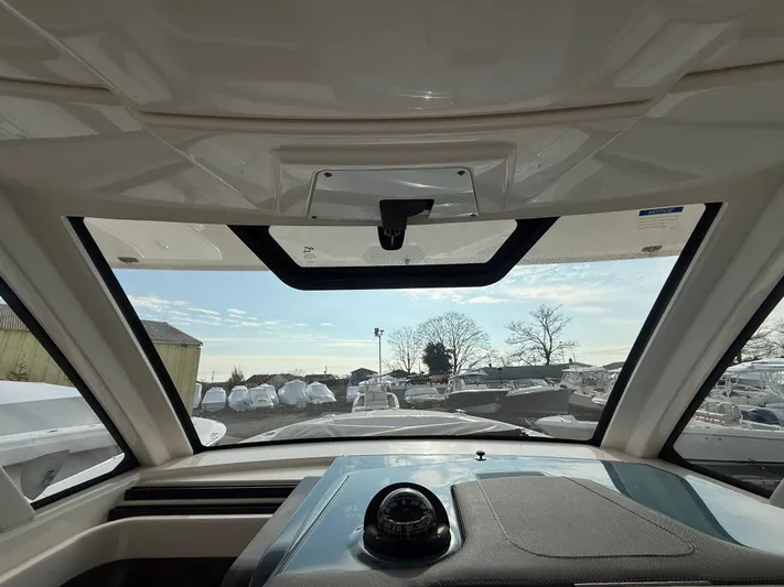 "ahhh Nice" Yacht Photos Pics Interior view of 2018 Pursuit S 368 Sport overlooking the harbor.