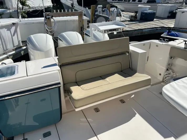 "ahhh Nice" Yacht Photos Pics 2018 Pursuit S 368 Sport boat with bench seating at dock.