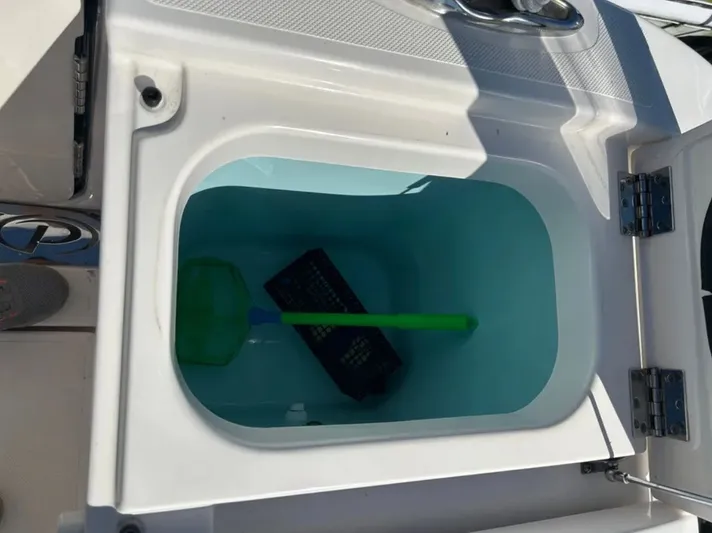 "ahhh Nice" Yacht Photos Pics Open storage compartment on a 2018 Pursuit S 368 Sport boat.