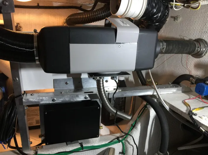 Mano 1 Yacht Photos Pics Engine room of 2011 Mainship 395 Trawler with mechanical components and wiring.