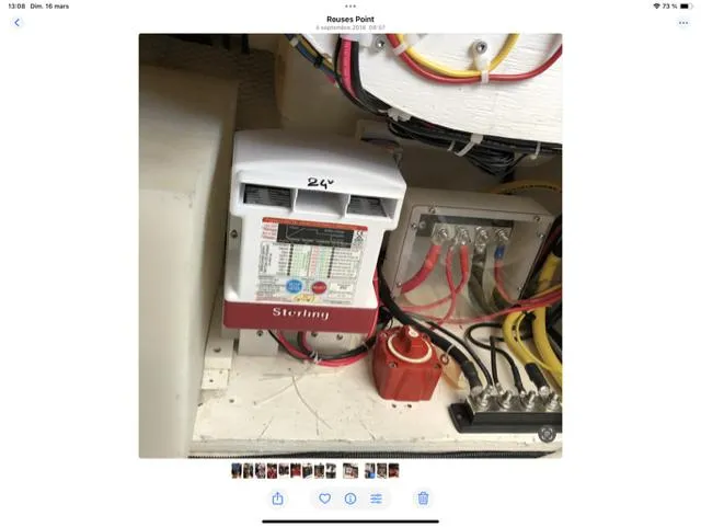 Mano 1 Yacht Photos Pics Electrical system components on a 2011 Mainship 395 Trawler, featuring wiring and a Sterling charger.