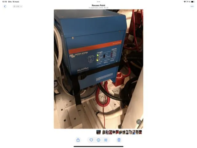 Mano 1 Yacht Photos Pics Engine room of 2011 Mainship 395 Trawler with blue electrical equipment.