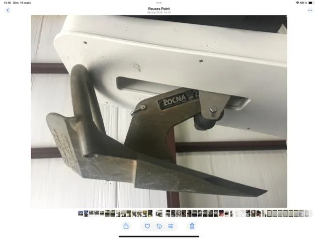 Mano 1 Yacht Photos Pics Anchor of 2011 Mainship 395 Trawler, featuring Rocna design, in a storage setting.