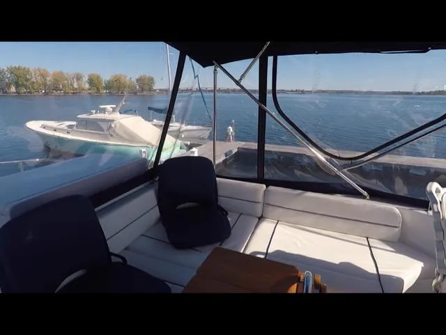 Mano 1 Yacht Photos Pics 2011 Mainship 395 Trawler interior with lake view and docked boat.