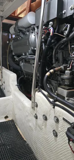 Mano 1 Yacht Photos Pics Engine room of 2011 Mainship 395 Trawler, showcasing detailed mechanical components.