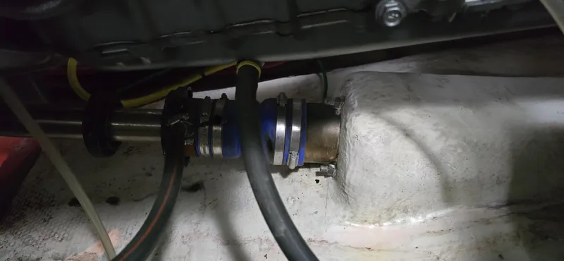 Mano 1 Yacht Photos Pics Engine compartment of a 2011 Mainship 395 Trawler showing hoses and fittings.