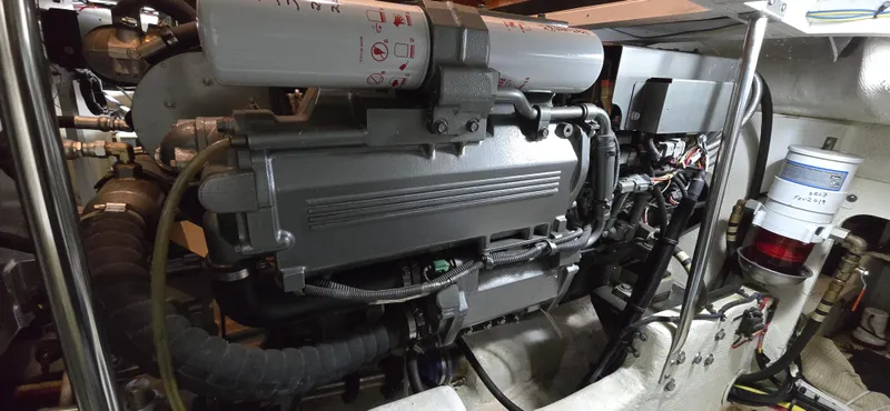 Mano 1 Yacht Photos Pics Engine room of 2011 Mainship 395 Trawler, showcasing mechanical components and systems.