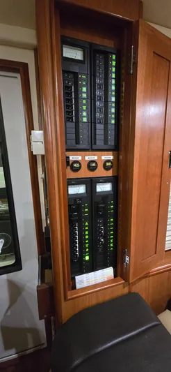 Mano 1 Yacht Photos Pics Electrical panel inside 2011 Mainship 395 Trawler, featuring circuit breakers and gauges.
