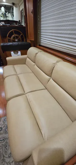 Mano 1 Yacht Photos Pics Beige leather sofa in 2011 Mainship 395 Trawler interior.