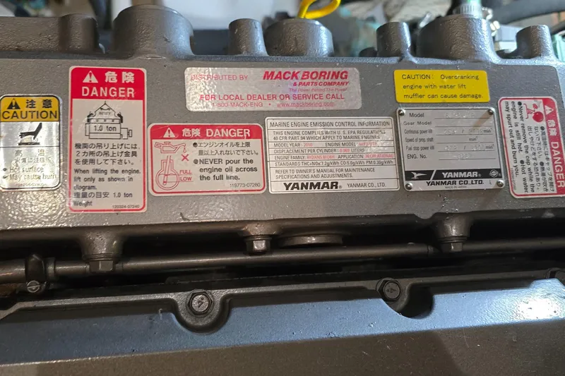 Mano 1 Yacht Photos Pics Engine warning labels on a 2011 Mainship 395 Trawler, featuring Yanmar components.