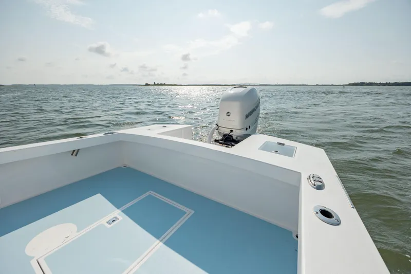  Yacht Photos Pics 2019 Gamefisherman 26 Cuddy Cabin boat on open water, featuring a sleek design.