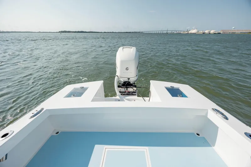  Yacht Photos Pics 2019 Gamefisherman 26 Cuddy Cabin boat on open water, rear view.