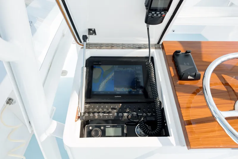  Yacht Photos Pics 2019 Gamefisherman 26 Cuddy Cabin dashboard with navigation and communication equipment.