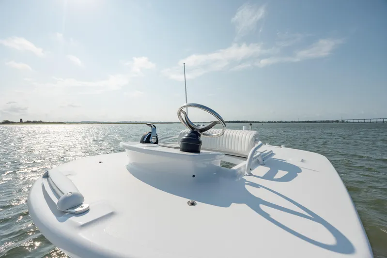  Yacht Photos Pics 2019 Gamefisherman 26 Cuddy Cabin boat on open water, sunny day, clear sky.