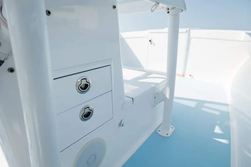  Yacht Photos Pics 2019 Gamefisherman 26 Cuddy Cabin interior with storage compartments and sleek design.