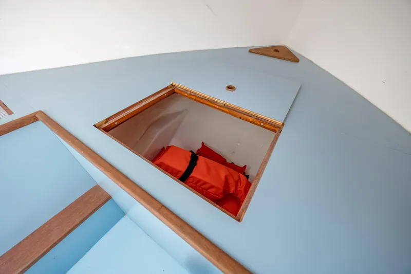  Yacht Photos Pics Interior storage compartment of 2019 Gamefisherman 26 Cuddy Cabin with life jackets.