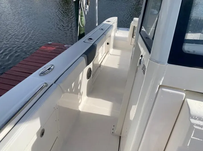  Yacht Photos Pics 2021 Robalo R272 Center Console boat docked by the water.