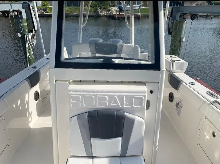  Yacht Photos Pics 2021 Robalo R272 Center Console boat interior with seating and console view.