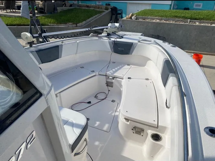  Yacht Photos Pics 2021 Robalo R272 Center Console boat interior with seating and storage.