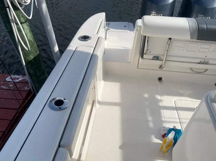  Yacht Photos Pics 2021 Robalo R272 Center Console boat interior with rod holders and seating.